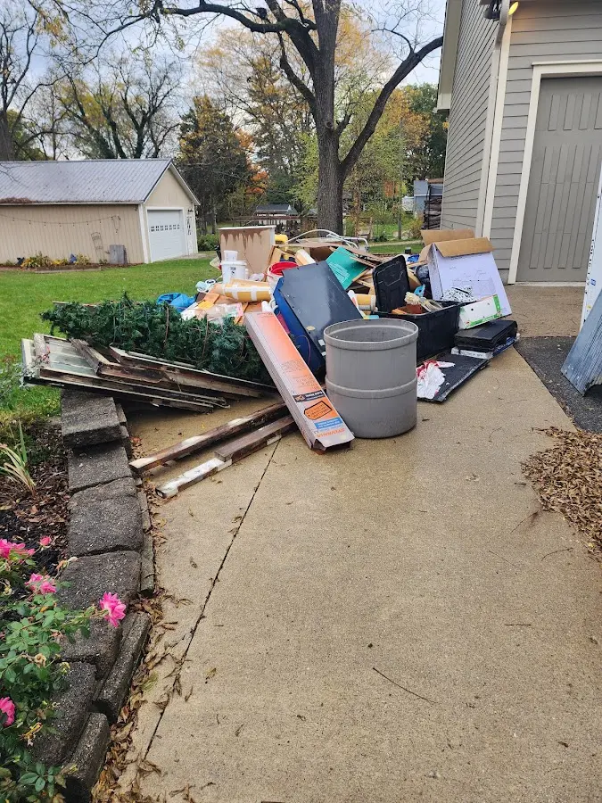Dumpster being loaded with debris for Estate Cleanout Dumpster Rental in Jefferson